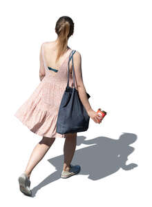 cut out top view of a woman in a pink summer dress walking