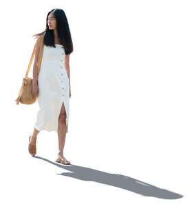 cut out backlit asian woman in a white dress walking