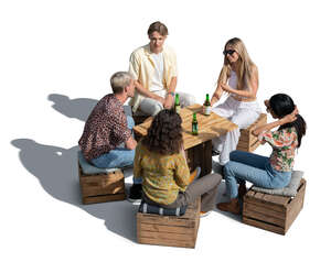 cut out group of young people sitting in an improvised cafe and drinkig beer