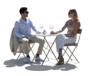 cut out elegant backlit man and woman sitting in a street cafe