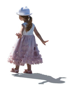cut out little backlit girl in  pink summer dress walking