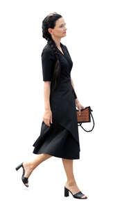 cut out woman in a chic black dress walking