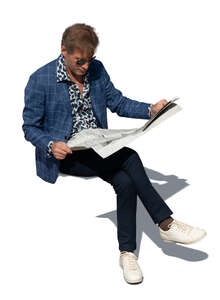cut out top view of a middle aged man sitting and readning a newspaper