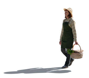 cut out older woman working in the garden carrying a basket