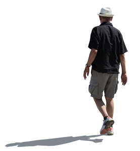 cut out elderly backlit man walking in summer