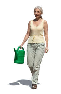 cut out elderly lady with a watering can walking