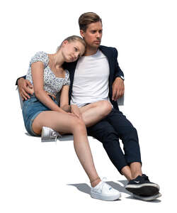 cut out young couple sitting