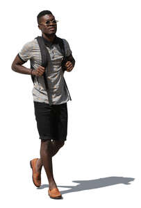 cut out young black man with a backpack walking