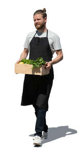 cut out market worker carrying a box full of vegetables