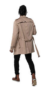cut out man in a brown trenchcoat walking