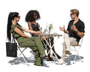 cut out group of three people sitting in an outdoor restaurant