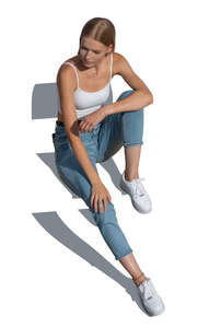 cut out young woman sitting seen from above