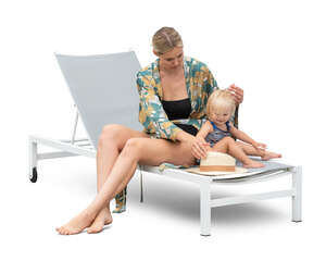 cut out woman playing with her baby daughter on a beach chair