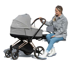 cut out woman sitting and rocking a baby carriage