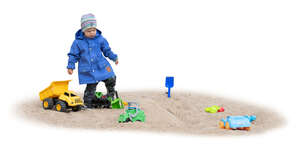 cut out little boy playing in the sand box