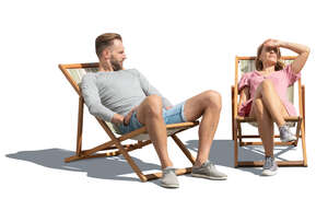 cut out man and woman sitting on garden chairs and relaxing in the sun