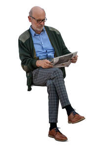 cut out elderly man sitting and reading a newspaper