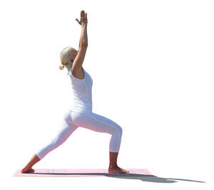 cut out backlit woman doing yoga