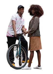 cut out man with a bike standing beside a woman and smiling