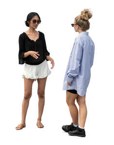 two cut out women standing and talking