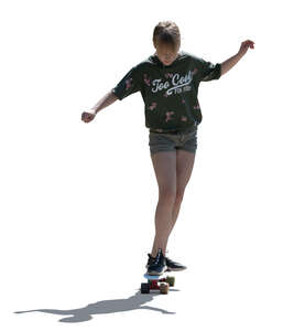 cut out backlit girl riding a skateboard