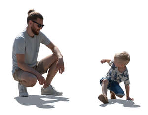 cut out backlit father and son playing