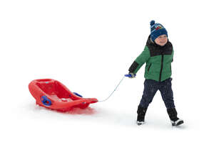 cut out little boy with a sledge walking