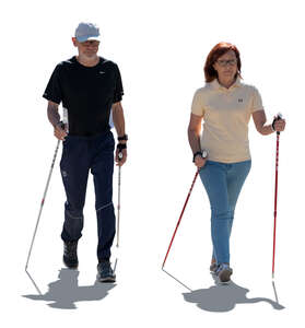 cut out backlit elderly couple nordic walking