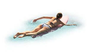 cut out woman paddling on surfboard
