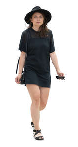 cut out woman in a black mini dress walking