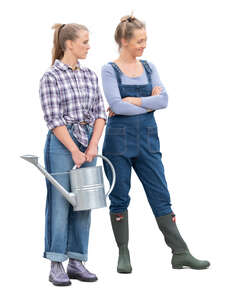 two cu out women working in the garden standing
