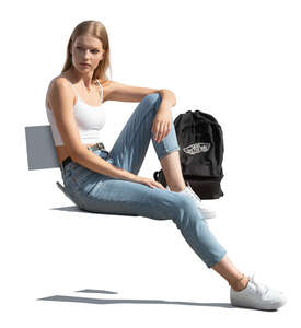 cut out young woman sitting outside