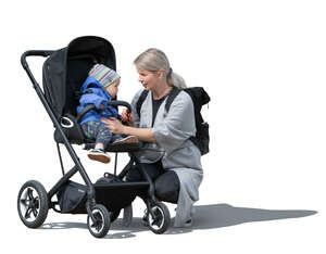 cut out woman talking with her little child in a stroller