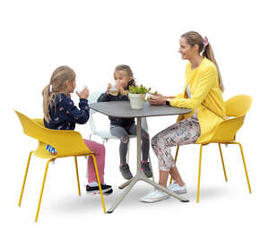 cut out woman with two daughters sitting in a cafe