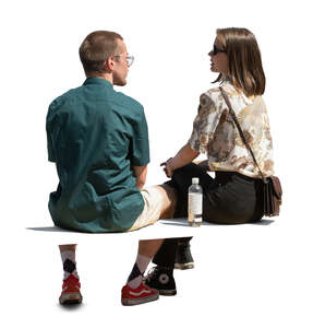 cut out man and woman sitting seen from back angle