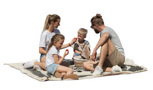 cut out family having a picinc outside in the park