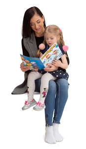 cut out girl sitting on her mothers lap and reading a book