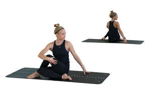 cut out woman doing yoga in front of the mirror