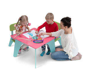 cut out woman and two kids drawing at a childrens table