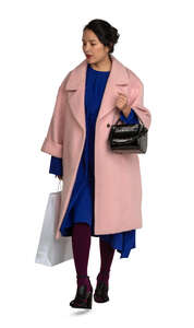 cut out asian woman in a pink overcoat walking
