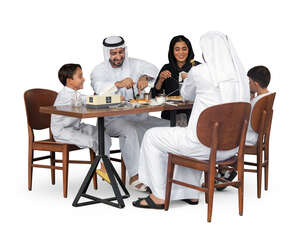 cut out arab family sitting in a restaurant and eating