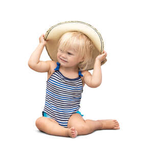 cut out little girl in a swimsuit sitting and laying with a hat