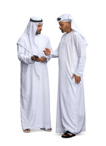 two cut out arab men wearing emirati kandoras standing and talking