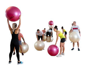 cut out group training with exercise balls in gym