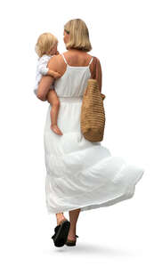 cut out woman in a white dress walking with a baby in her lap