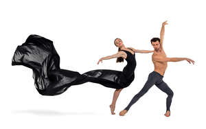 cut out ballet dancers with long black dress performing