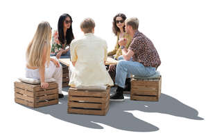 cut out backlit group of people sitting on boxes and talking