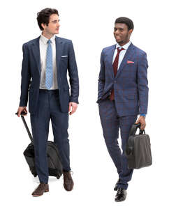 two travelling businessmen walking