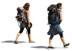 two women with huge backpacks walking on the road