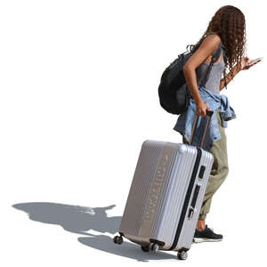 african woman with a suitcase walking down the street